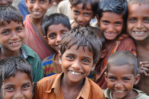 Portrait of a smiling Indian boy with his friends in the background.