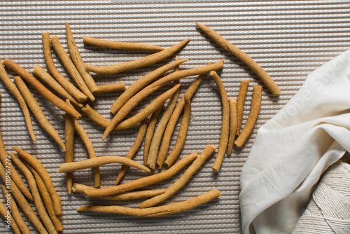 Top view of fried corn stick snack on a baking tray, Overhead view of nigerian kokoro corn snack photo