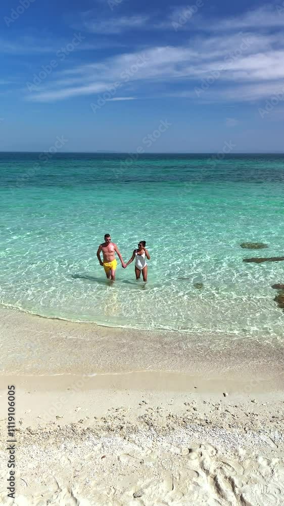 Discover the beauty of Koh Munnork Island, where two adventurers wade hand-in-hand through stunning turquoise waters. Experience the thrill of nature's paradise and unforgettable moments. Discover the beauty of Koh Munnork Island, where two adventurers wade hand-in-hand through stunning turquoise waters. Experience the thrill of nature's paradise and unforgettable moments.