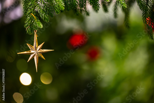 Christmas tree with golden star bauble ornaments. Decorated Christmas tree closeup. star and illuminated garland with flashlights. bokeh. Winter holiday light decoration