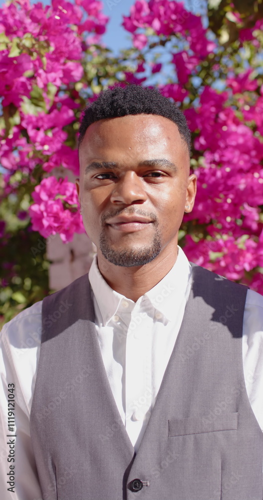 Vertical image of portrait of happy african american man looking at camera and smiling Vertical image of portrait of happy african american man looking at camera and smiling