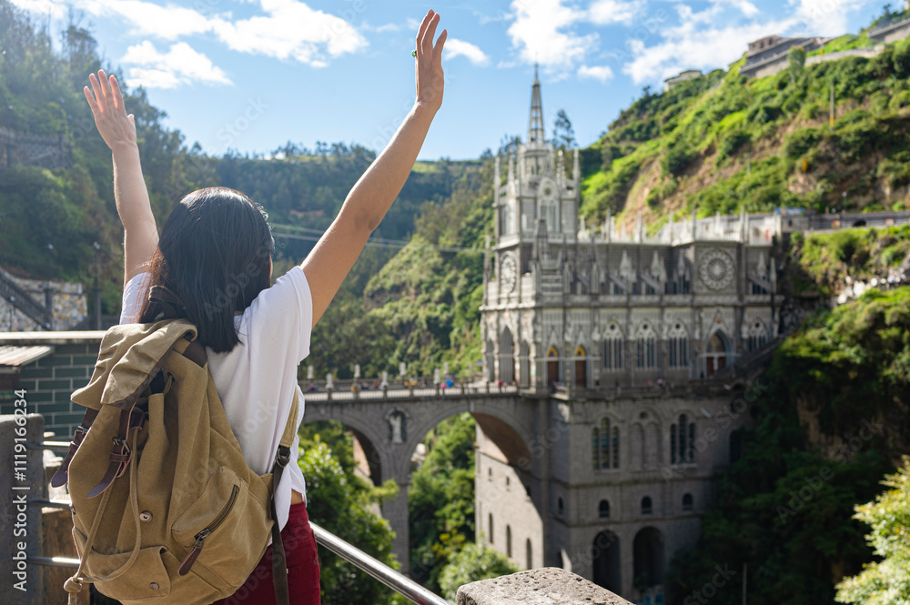 Fototapeta premium Female tourist at the church of Las Lajas, in southern Colombia