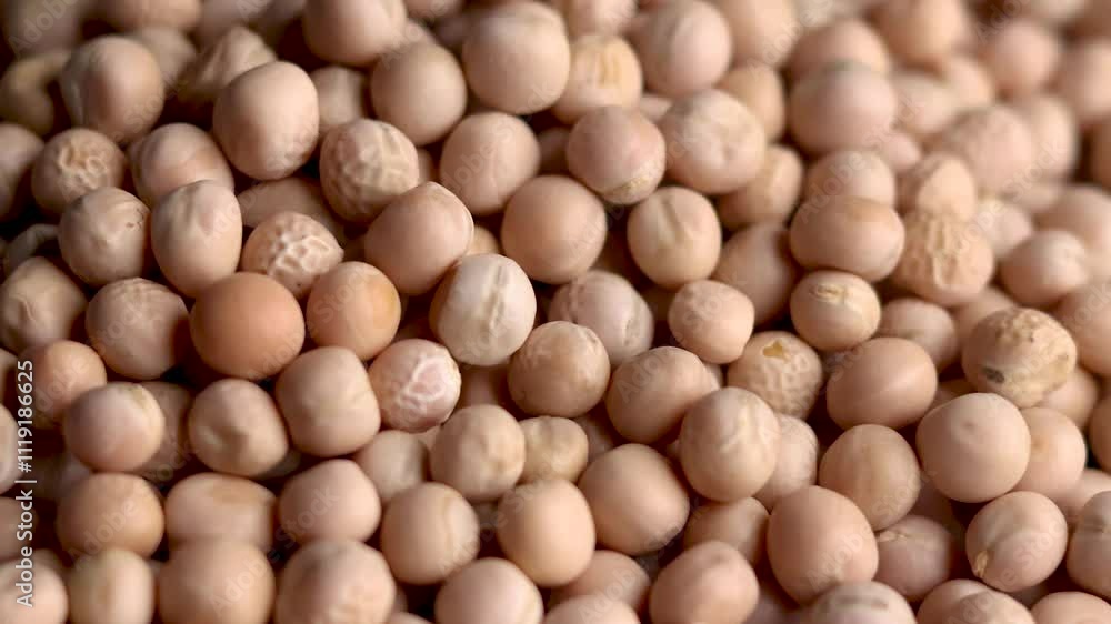 Raw whole dried white peas rotating closeup Raw whole dried white peas rotating closeup