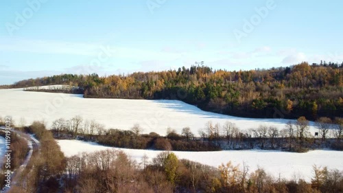 Snow-Covered Plains And Forests Near Boundary Peak Lookout Tower In Albrechtice, Czech Republic. Aerial Drone Shot photo