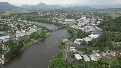 Wollumbin Street Bridge Crossing Tweed River In Murwillumbah, NSW, Australia. aerial pullback shot photo