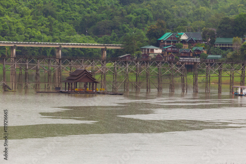 Uttamanusorn Bridge commonly known as Wooden Mon Bridge is famous that the longest wooden bridge in Thailand located in Sangkla Buri, Kanchanaburi. photo