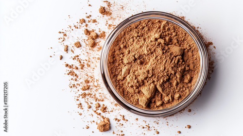 Professional Photograph of Yellow-Brown Powder in Round Glass Container on White Surface photo