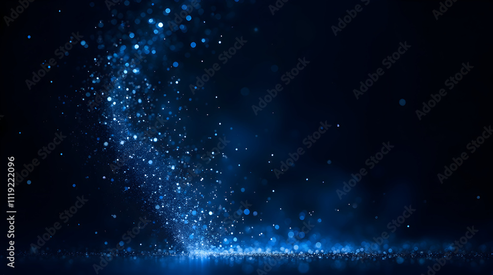 Obraz premium Stunning Blue Particle Effect Lighting Up the Dark Background with Sparkling Dust