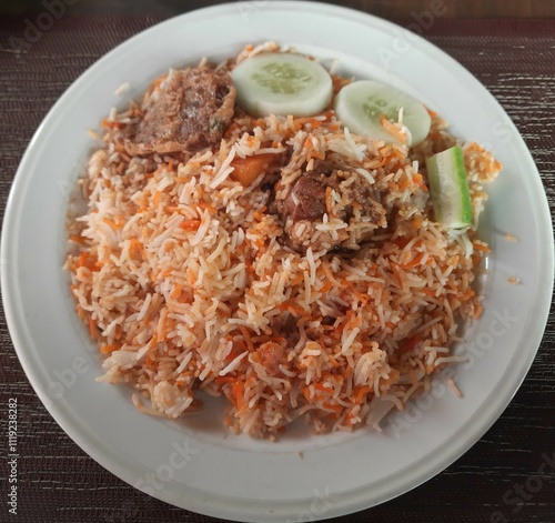 Mutton Kacchi Biriyani with Shami Kebab, Lemon, Cucumber  photo