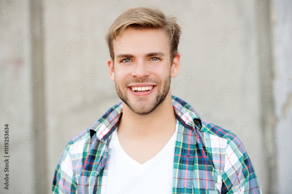 Portrait of happy man in casual style shirt. Stylish face portrait of unshaven guy. Handsome young man outdoor. Millennial man wearing checkered shirt. Casual style of millennial man Portrait of happy man in casual style shirt. Stylish face portrait of unshaven guy. Handsome young man outdoor. Millennial man wearing checkered shirt. Casual style of millennial man