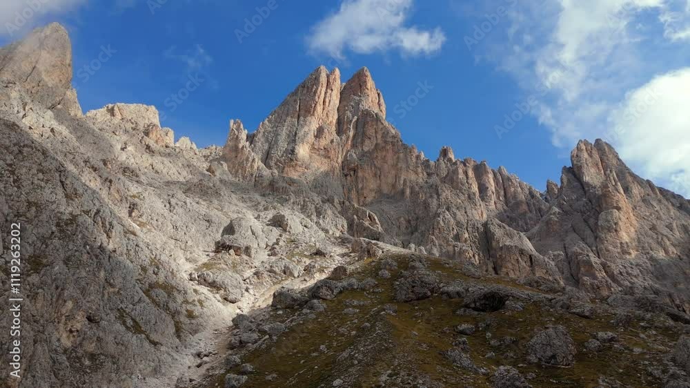 The jagged peaks of Langkofel (Sassolungo) rise dramatically in the Dolomites, framed by vibrant blue skies. This stunning alpine landscape is a paradise for hikers and nature enthusiasts. The jagged peaks of Langkofel (Sassolungo) rise dramatically in the Dolomites, framed by vibrant blue skies. This stunning alpine landscape is a paradise for hikers and nature enthusiasts.