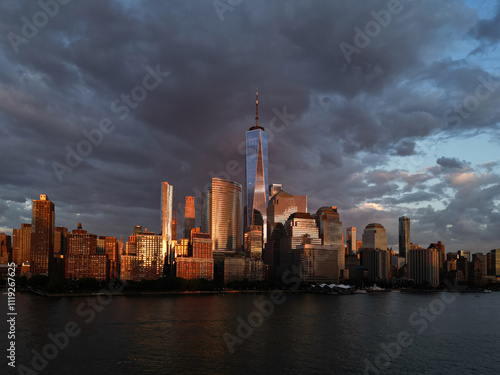 NYC, New York City Skyline with dramatic sky. American Urban Skyscrapers USA near dramatic clouds. New York City skyline, cityscape of Manhattan in USA. Panoramic view on Manhattan.