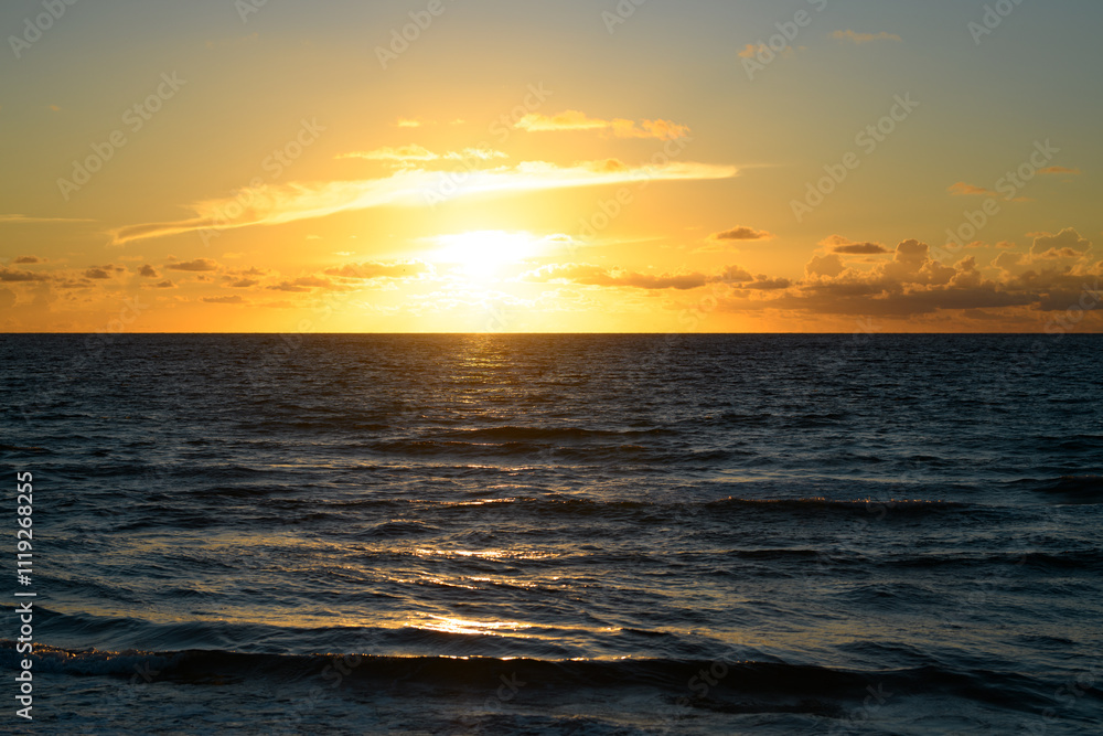 Sunset on sea. Ocean beach sunrise with calm cloudy sky. Sunset on sea. Ocean beach sunrise with calm cloudy sky.