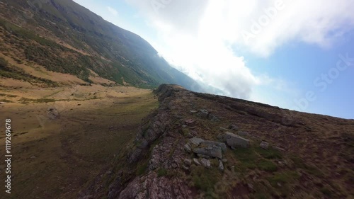 Aerial Drone shot while diving a mountain in the Cantabria photo