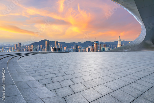 Empty square floor and bridge with modern city buildings scenery at sunset in Shenzhen. Outdoor city background.