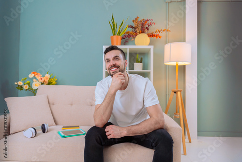 Konstfotografi A man sits in a comfortable living room, deep in thought
