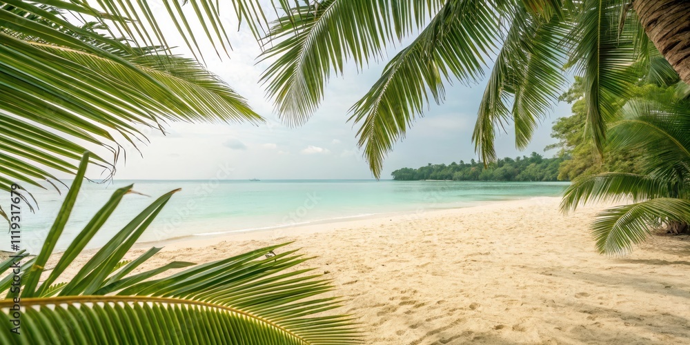Fototapeta premium A picturesque tropical beach scene framed by lush palm fronds, showcasing tranquil turquoise water and pristine sand