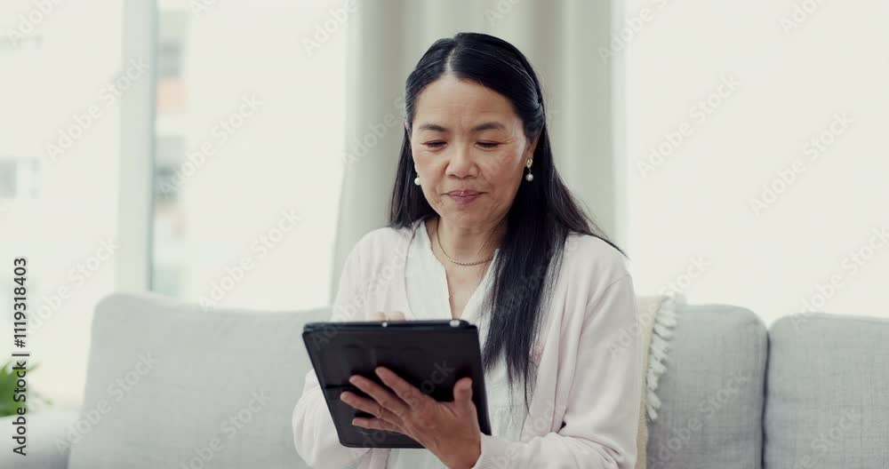 Senior woman, tablet and home for video call, talking and online for typing message to contact. Elderly person, couch and speaking to friend in retirement, virtual conversation and site for post Senior woman, tablet and home for video call, talking and online for typing message to contact. Elderly person, couch and speaking to friend in retirement, virtual conversation and site for post