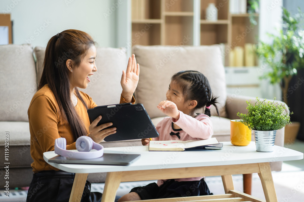 Mother and daughter spend their holiday in the living room at home, daughter kissing happy mother. Mother and daughter spend their holiday in the living room at home, daughter kissing happy mother.