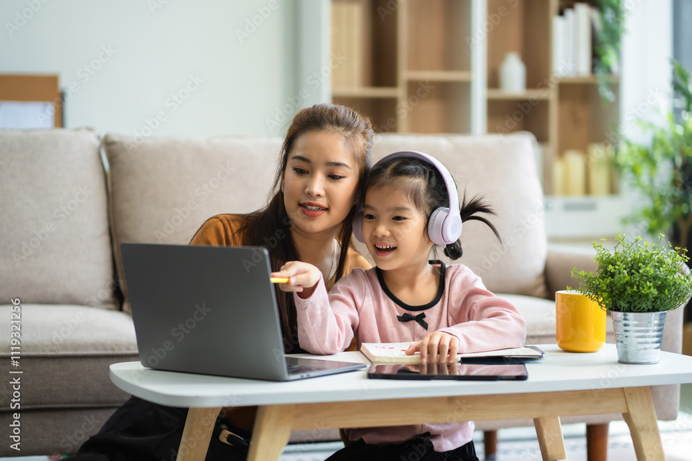 Mother and daughter spend their holiday in the living room at home, daughter kissing happy mother. Mother and daughter spend their holiday in the living room at home, daughter kissing happy mother.