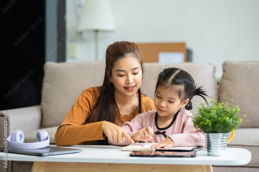 Mother and daughter spend their holiday in the living room at home, daughter kissing happy mother. Mother and daughter spend their holiday in the living room at home, daughter kissing happy mother.