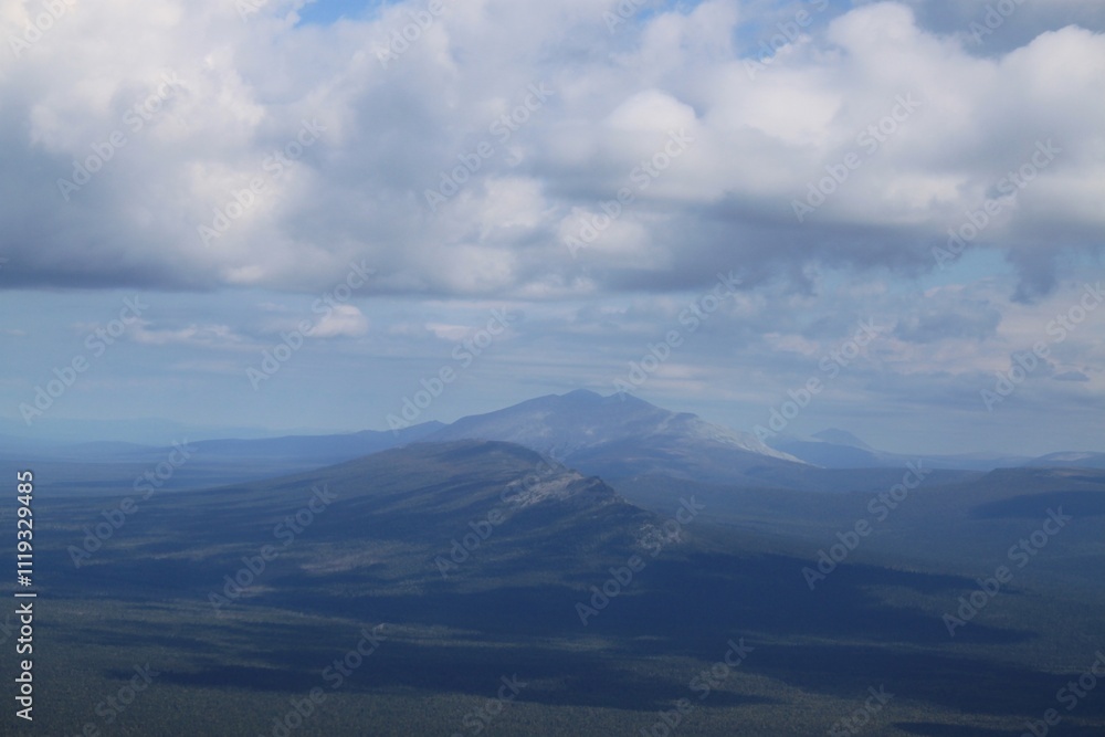 Fototapeta premium A mountain range is visible in the distance with a blue sky above