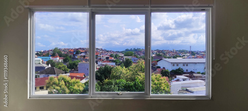 large window, divided into three window frames, with beautiful views, residential area, city landscape, green trees, partly cloudy sky, patch of blue sky, window frames, urban planning, architecture