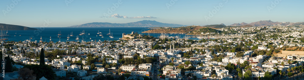 Fototapeta premium Panoramic view of the city of Bodrum. Overhead view of St. Peter's Castle and the marina. Bodrum is a large and famous resort town on the Aegean coast of Turkey. Mugla province, Türkiye 
