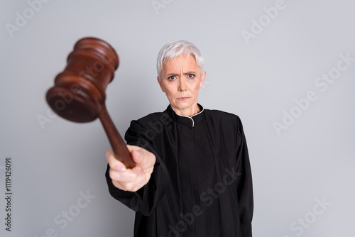 Obraz na plátně Photo of serious woman government judge hit gavel court verdict isolated grey co