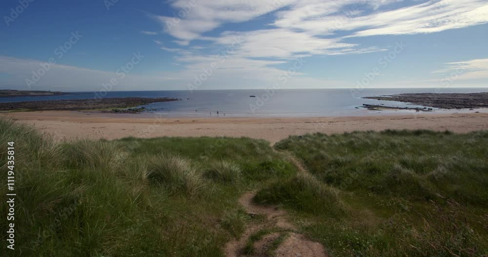 extra wide shot looking north east from the dunes at Longhoughton beach of the howdiemony sands at lowtide, Alnwick extra wide shot looking north east from the dunes at Longhoughton beach of the howdiemony sands at lowtide, Alnwick