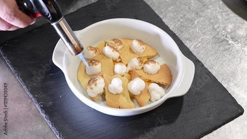 Top-Down Close-Up: Chef Torching Mini Mozzarella Dish photo