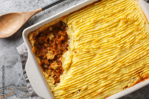 Obraz na płótnie Mushroom meatless shepherd's pie without meat with lentils, onions, tomatoes, carrots close-up in a baking dish on the table. Horizontal top view from above w salonie