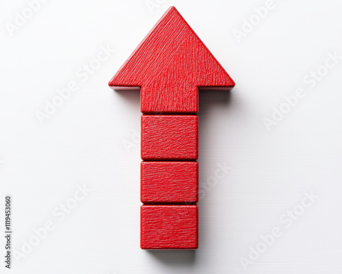 Red blocks arranged in upward arrow shape on white background photo