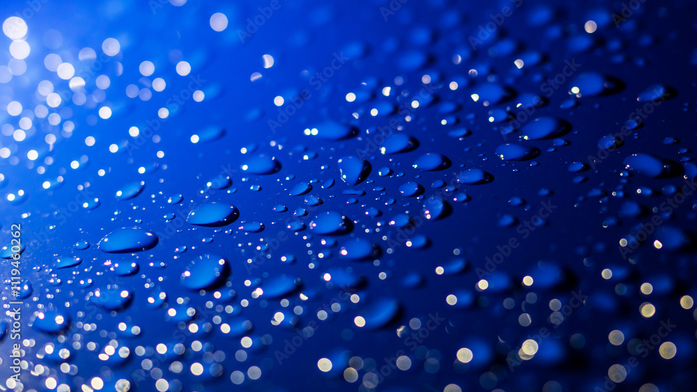 A vibrant blue background adorned with an abundance of water drops A vibrant blue background adorned with an abundance of water drops