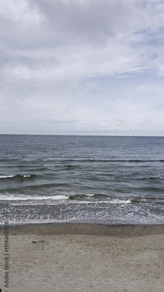 Sea waves rolling onto the sandy shore of the Baltic Sea Sea waves rolling onto the sandy shore of the Baltic Sea