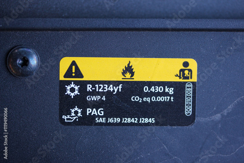 Air conditioning sticker in the engine bay of a modern vehicle
