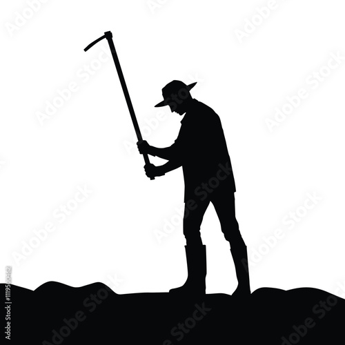 Silhouette of a farmer hoeing the soil with a hoe