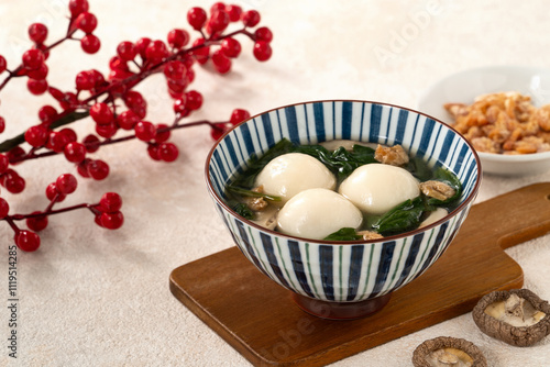 Eating big tangyuan yuanxiao with savory soup in Taiwan. photo