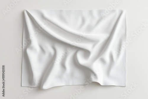 Crumpled white fabric draped on flat surface showcasing texture and softness