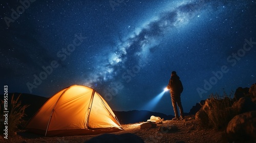 Adventurer uses a flashlight to explore the nighttime scenery, with a warm glowing tent set against the stunning backdrop of the milky way