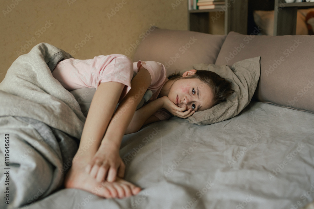 A sick child with skin rashes in bed. Child's skin with many red spot. Allergic reaction, Drug allergy, Scarlet fever, Atopic dermatitis, Diaper rash, Urticaria, Scabies, Heat rash. A sick child with skin rashes in bed. Child's skin with many red spot. Allergic reaction, Drug allergy, Scarlet fever, Atopic dermatitis, Diaper rash, Urticaria, Scabies, Heat rash.