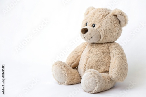 Soft neutral colored plush teddy bear sitting in a serene indoor setting