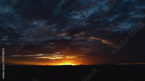 Dramatic Storm Clouds at Sunrise Timelapse Wide Shot