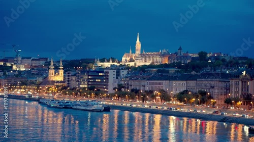 Fisherman's Bastion with Matthias Church Gothic Architecture.Street lights glowing and reflection on the Danube River. Night view from the Margit Bridge on Danube river. Cityscape of Budapest.