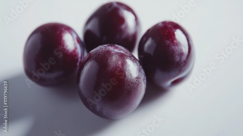 Wallpaper Mural Close up of fresh, ripe plums arranged on a white background highlighting their rich color and texture for food and health concepts Torontodigital.ca
