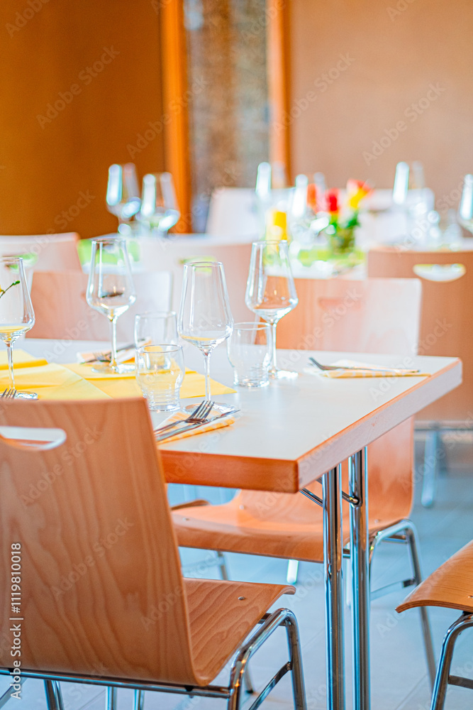 Restaurant Table Setting with Wine Glasses and Yellow Napkins in a Modern Dining Environment Creating a Sophisticated and Inviting Atmosphere for Gourmet Dining Experiences and Special Occasions Restaurant Table Setting with Wine Glasses and Yellow Napkins in a Modern Dining Environment Creating a Sophisticated and Inviting Atmosphere for Gourmet Dining Experiences and Special Occasions