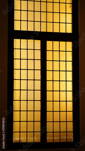 The classical glass window interior view with the lighs on as background photo