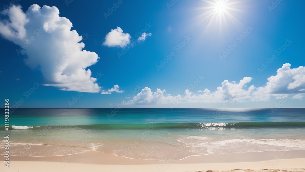 Obraz premium Panoramic photograph of a serene beach with soft beige sand, turquoise ocean waves, and a clear blue sky dotted with white clouds under the radiant sun.