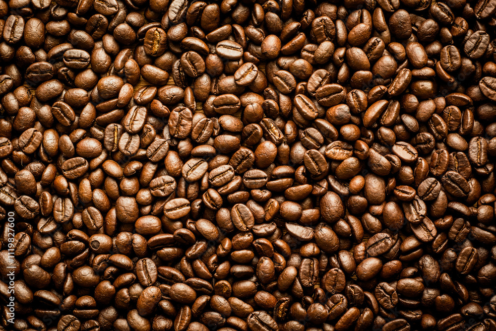 Naklejka premium A roasted coffee beans texture background.