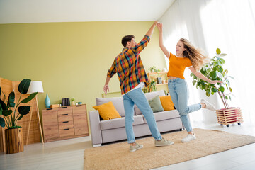 Full size photo of cute young couple dancing relax cheerful cozy day light spring summer home interior living room